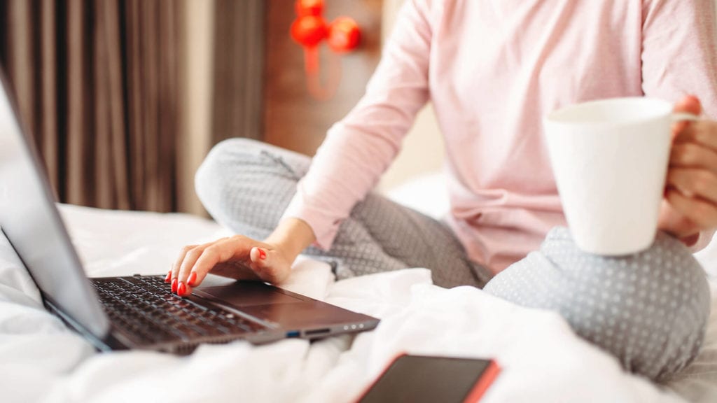 Woman working from home in pajamas