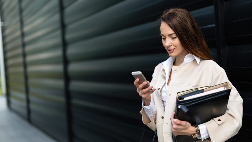 Why Mobile-friendly design is crucial for your business woman on smartphone  