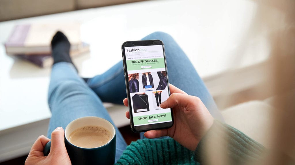woman shopping on smartphone Why Mobile-friendly design is crucial for your business on smartphone