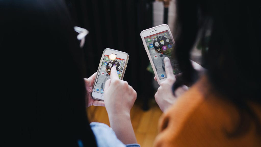 two women looks at smartphones why mobile-friendly design is crucial