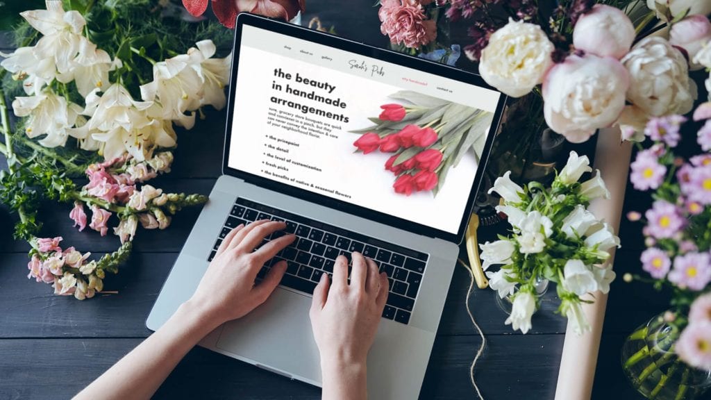 woman on computer looking at pillar content on website