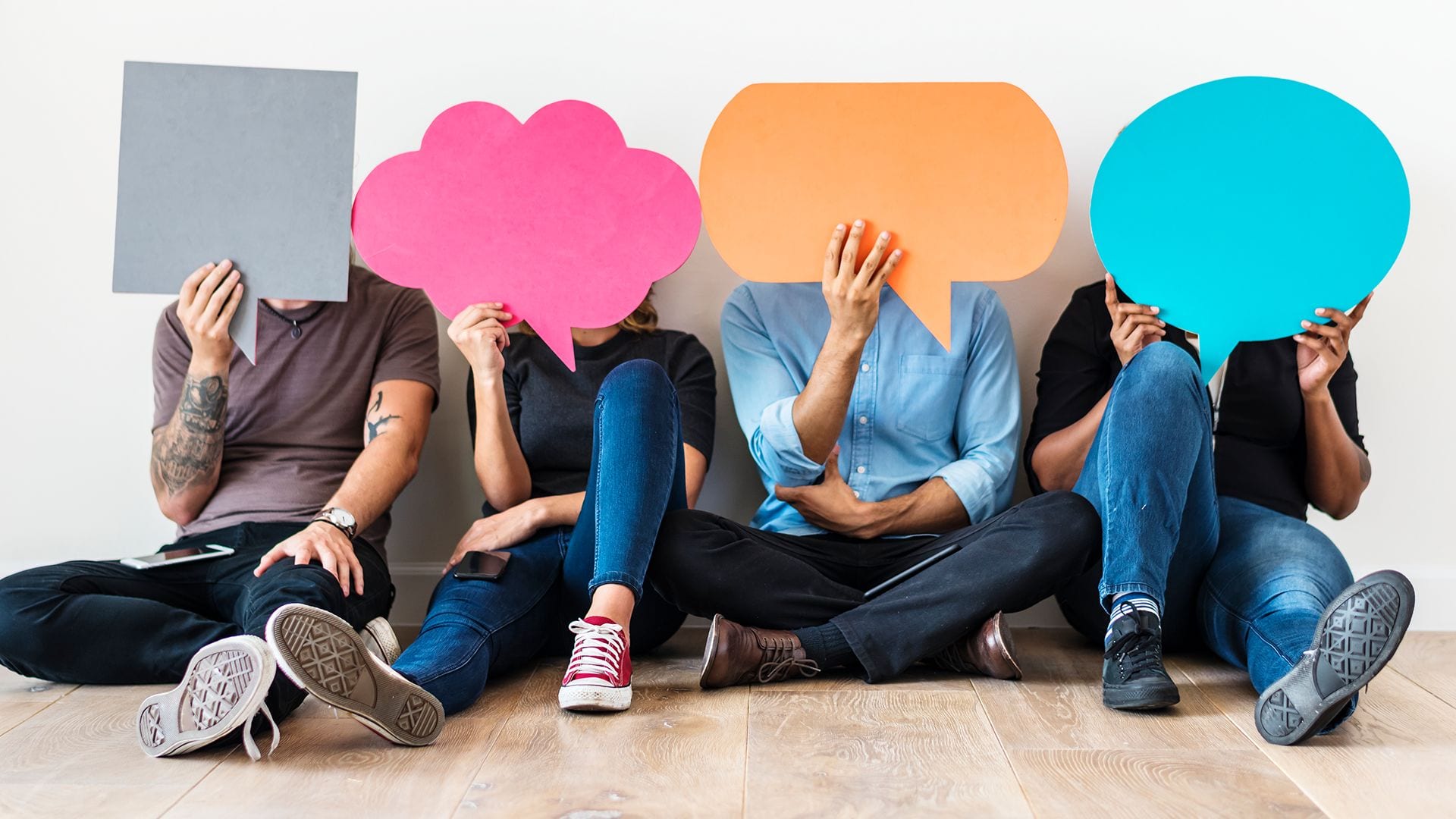 4 reasons why PR is crucial people sitting with speech bubbles over their face to symbolize brand awareness.