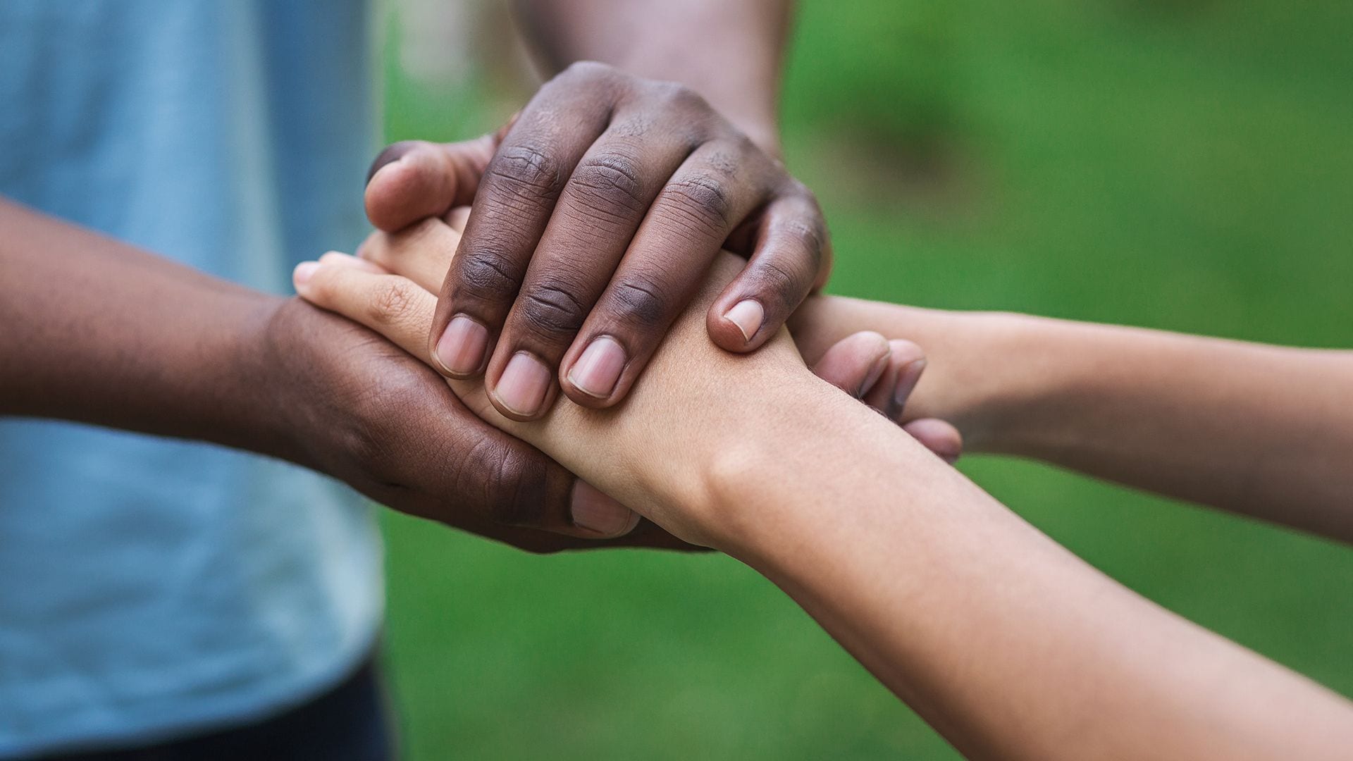 4 reasons why PR is crucial. Two people embracing hands to illustrate a business that gives back and has a solid reputation.