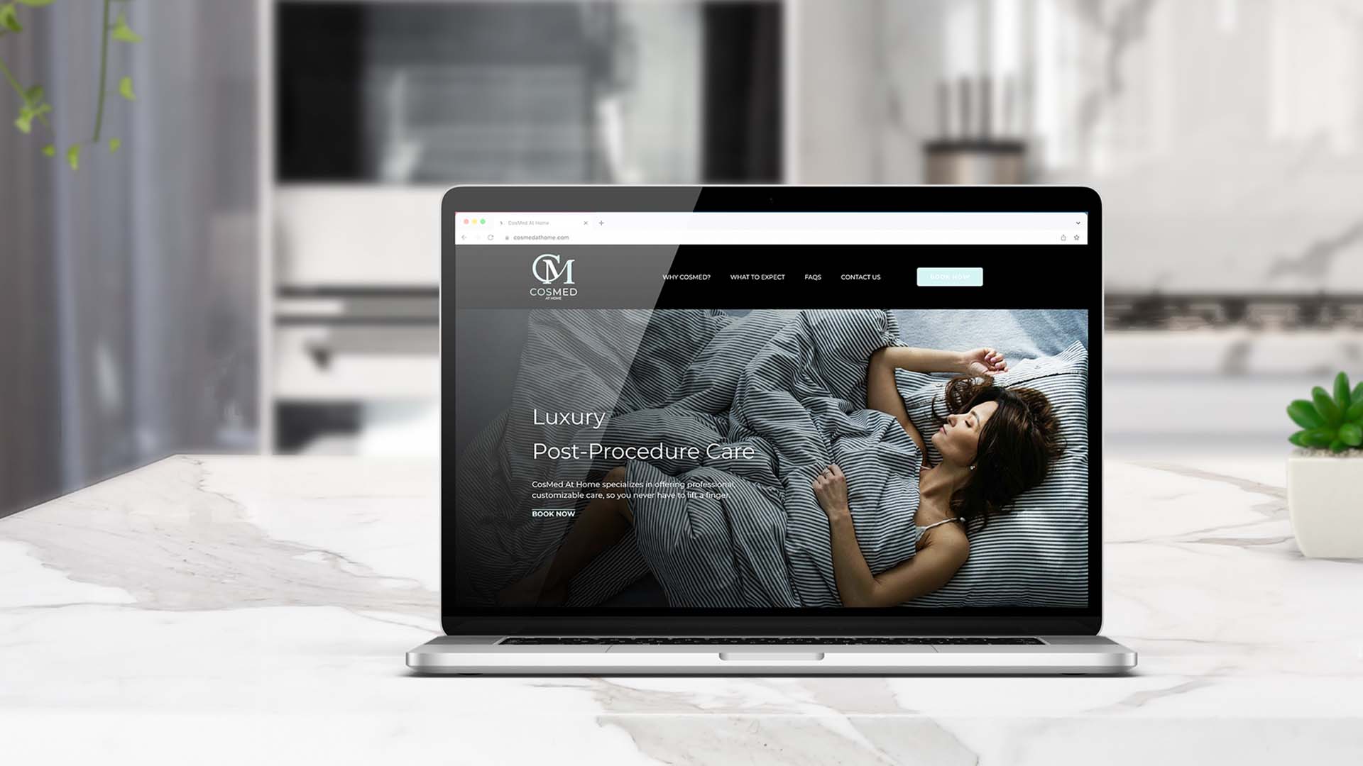 Cosmed website displayed on laptop